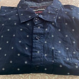 Blue button down shirt.